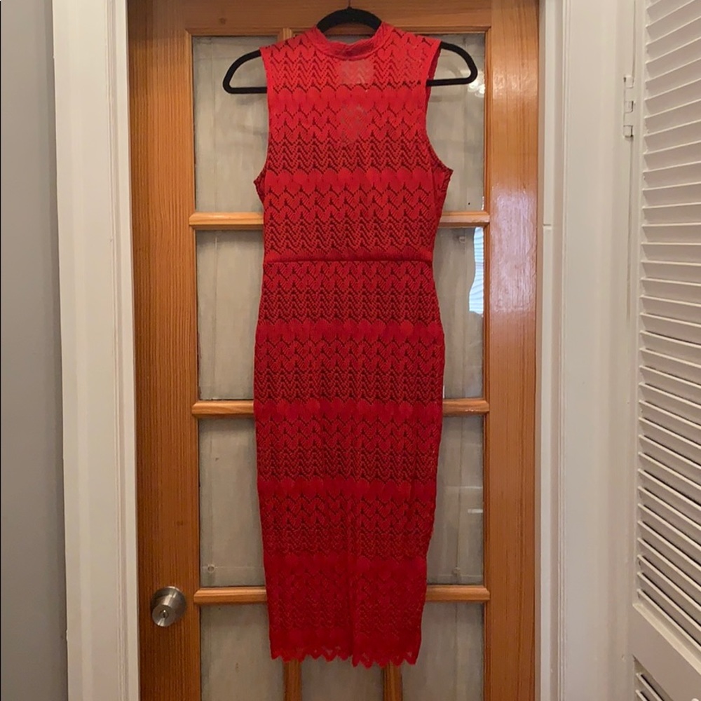 Tight midi length red lace dress
